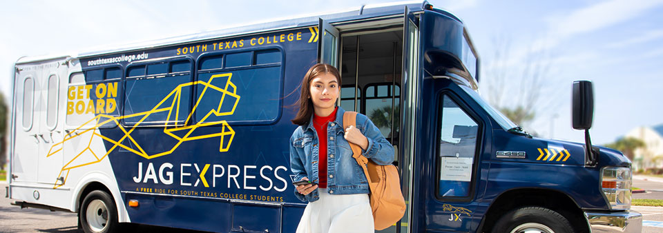 Student in front of bus