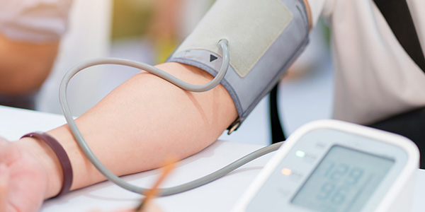 doctor checking blood pressure